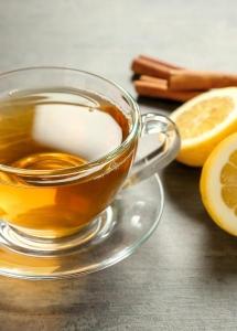 Cup of tea with cinnamon and lemon