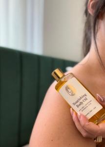 Woman with nourishing body Oil