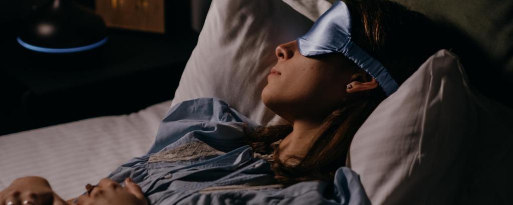 Woman sleeping with sleep mask